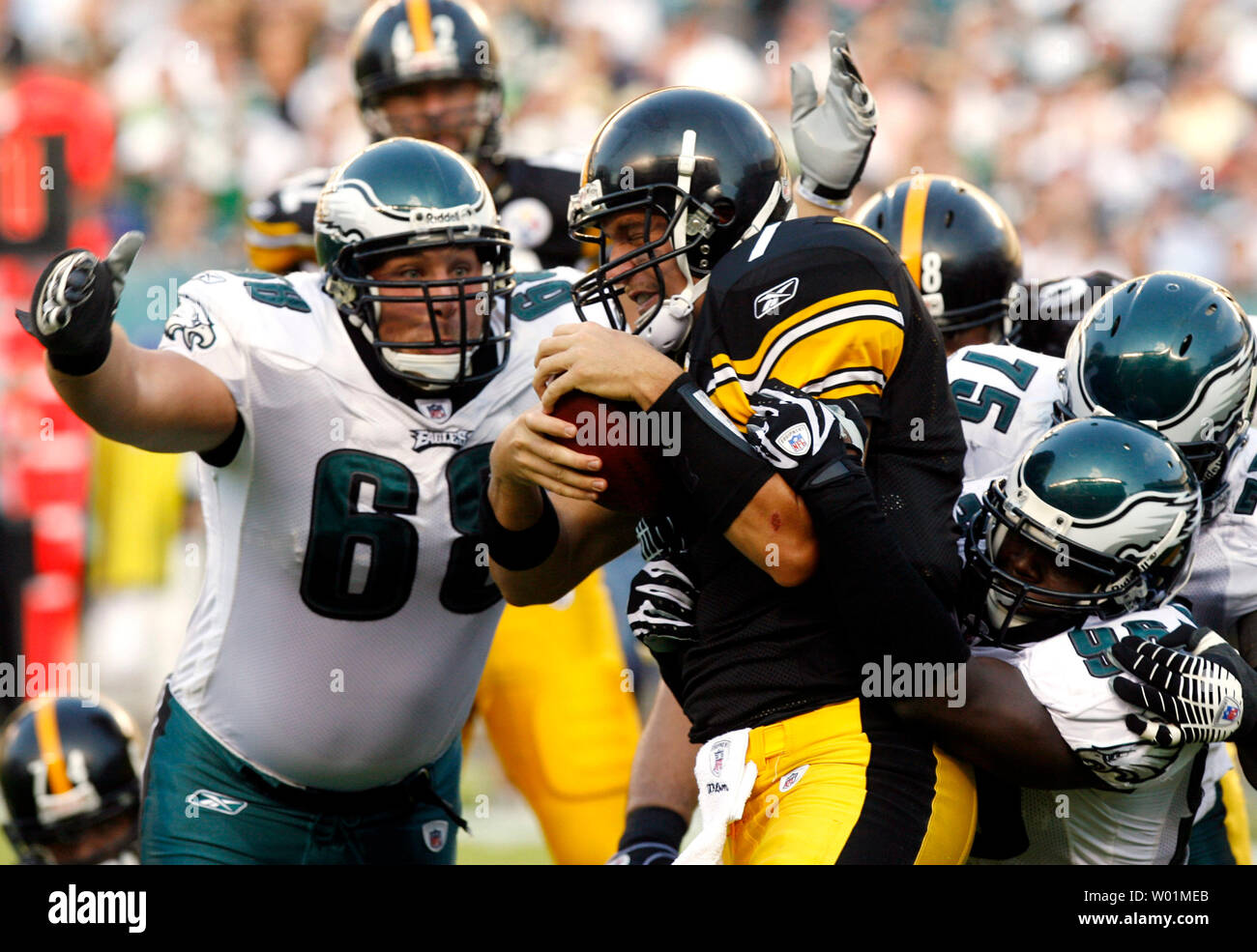 Pittsburgh Steelers quarterback Ben Roethlisberger  is sacked on the Pittsburgh 31-yard line for a 2-yard loss during first quarter play in Philadelphia at Lincoln Financial Field September 21, 2008. Making the sack are Philadelphia Eagles Dan Klecko (68), Mike Patterson (98) and Juqua Parker. Philadelphia defeated Pittsburgh 15-6.      (UPI Photo/John Anderson) Stock Photo