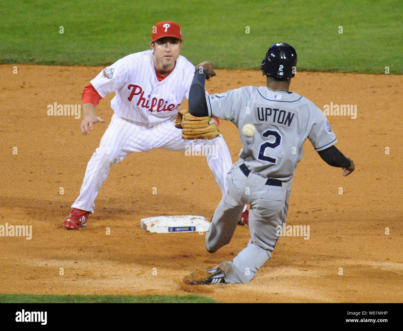Philadelphia Phillies second basemen Chase Utley waits for the late throw as Tampa Bay Rays B.J. Upton steals second on an pick off play in the sixth of game three of World Series in Philadelphia, Pennsylvania on October 25, 2008.    (UPI Photo/Pat Benic) Stock Photo