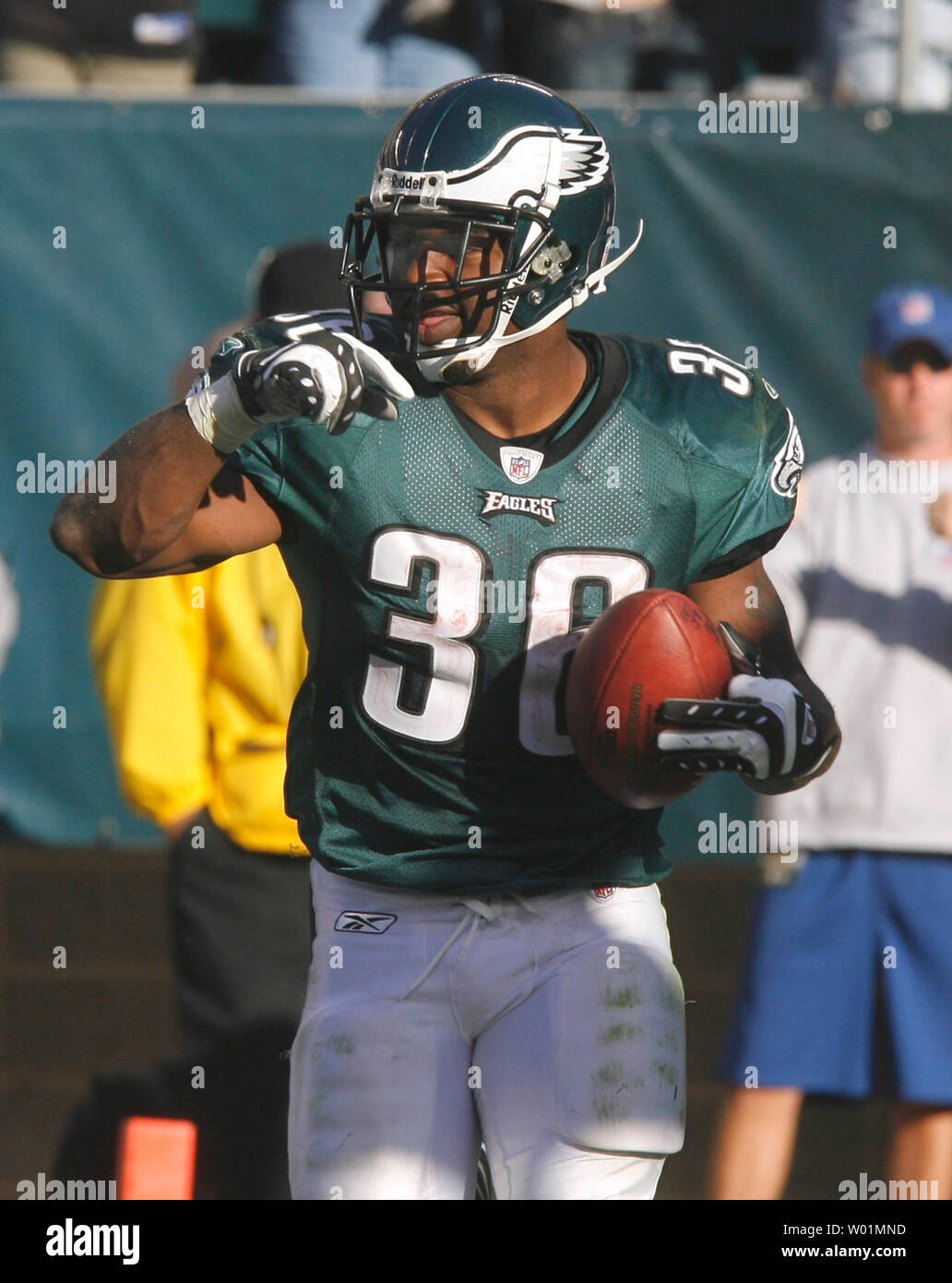 Philadelphia Eagles running back Brian Westbrook (36) gestures to the ball  with a grin after scoring a 39-yard touchdown during fourth quarter play in  Philadelphia at Lincoln Financial Field October 26, 2008.