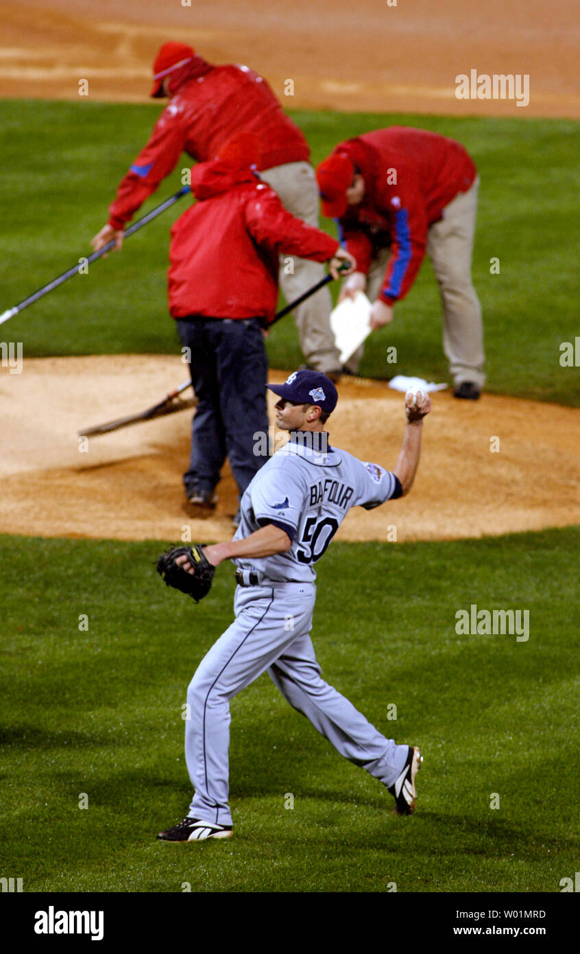 Tampa Bay Rays  pitcher Grant Balfour does some practice pitching as field work crews work on the mound and other parts of the field to add dirt and dry out the field from the constant rain durning fifth inning World Series game 5 play with the Philadelphia Phillies  in Philadelphia at Citizens Bank Park October 27, 2008.     (UPI Photo/John Anderson) Stock Photo