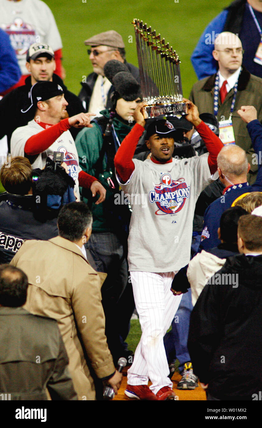 Philadelphia Phillies Jimmy Rollins carries the World Series Commissioners Trophy through the crowd followed by Brett Myers after Philadelphia defeated the Tampa Bay Rays to win the 2008 World Series in Philadelphia at Citizens Bank Park October 29, 2008.    (UPI Photo/John Anderson) Stock Photo