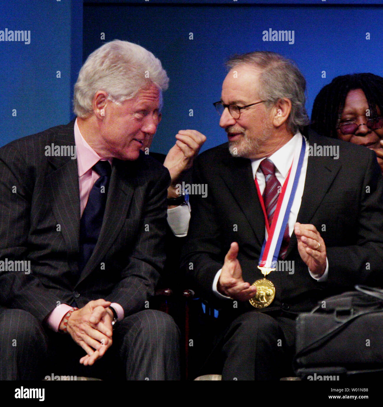 Filmmaker and humanitarian Steven Spielberg chats with former President Bill Clinton after receiving the 2009 Liberty Metal at the National Constitution Center in Philadelphia October 8, 2009l. Spielberg, received the award for his artistic and personal commitment to the preservation of human rights.    UPI/John Anderson  . Stock Photo
