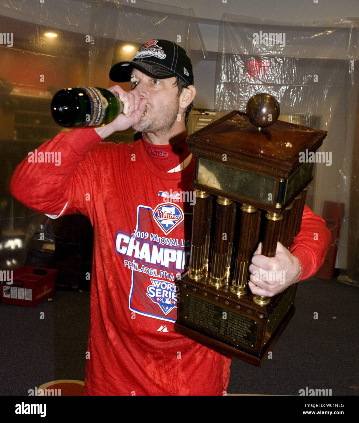 Philadelphia Phillies pitcher Jamie Moyer takes a swig of champagne as he holds the National League Championship trophy during celebrations in the locker room following their 10-4 win over the Los Angeles Dodgers in game five of the National League Championship Series in Philadelphia on October 21, 2009.     UPI/John Anderson Stock Photo