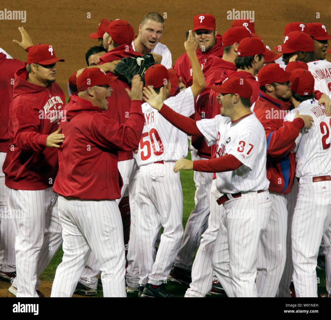 Philadelphia Phillies team members high five each other as they celebrate on the field following their 10-4 win over the Los Angeles Dodgers in game five of the National League Championship Series in Philadelphia on October 21, 2009.  .      UPI/Eileen Angelino Stock Photo