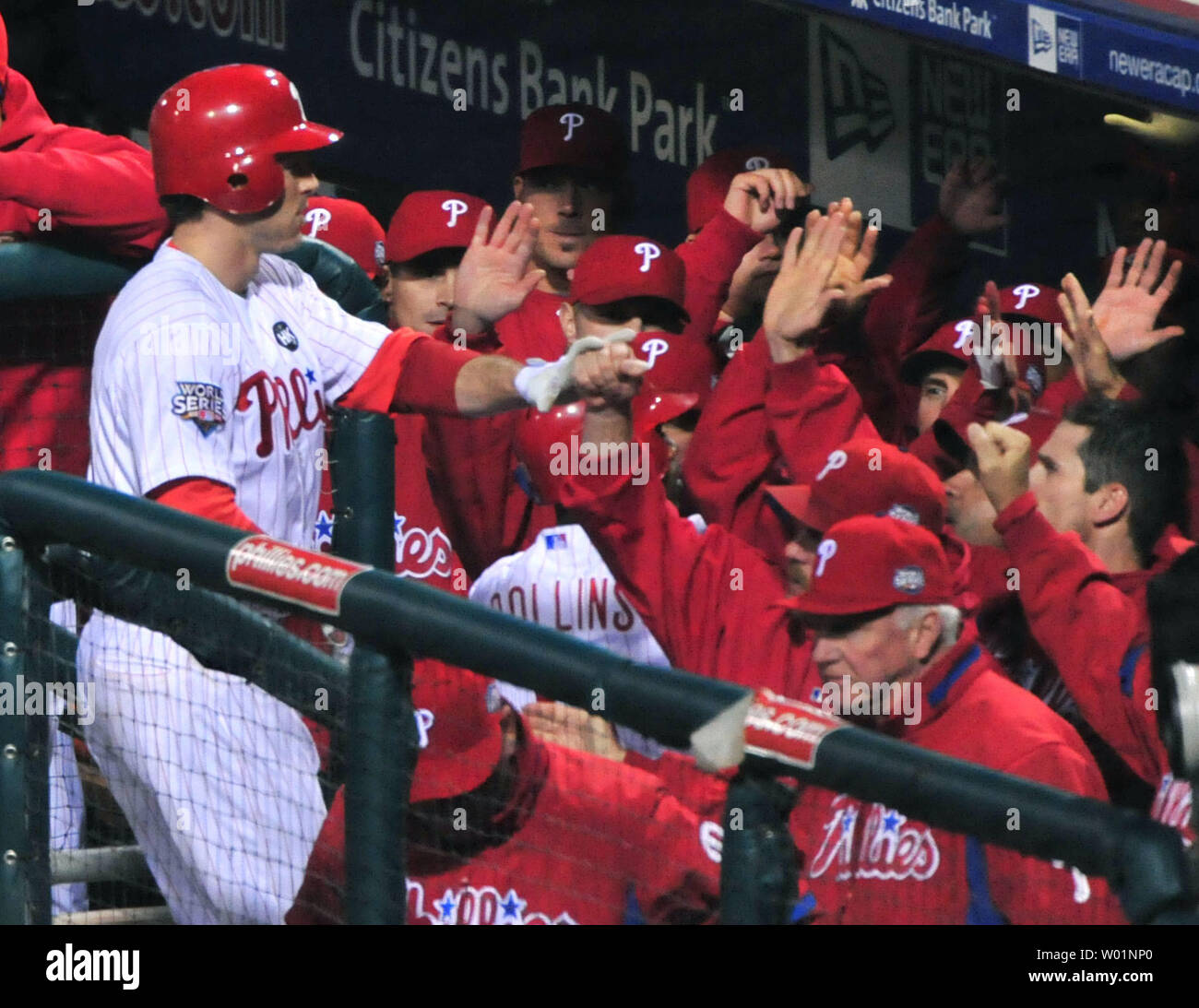 Philadelphia Phillies second baseman Chase Utley is congratulates by