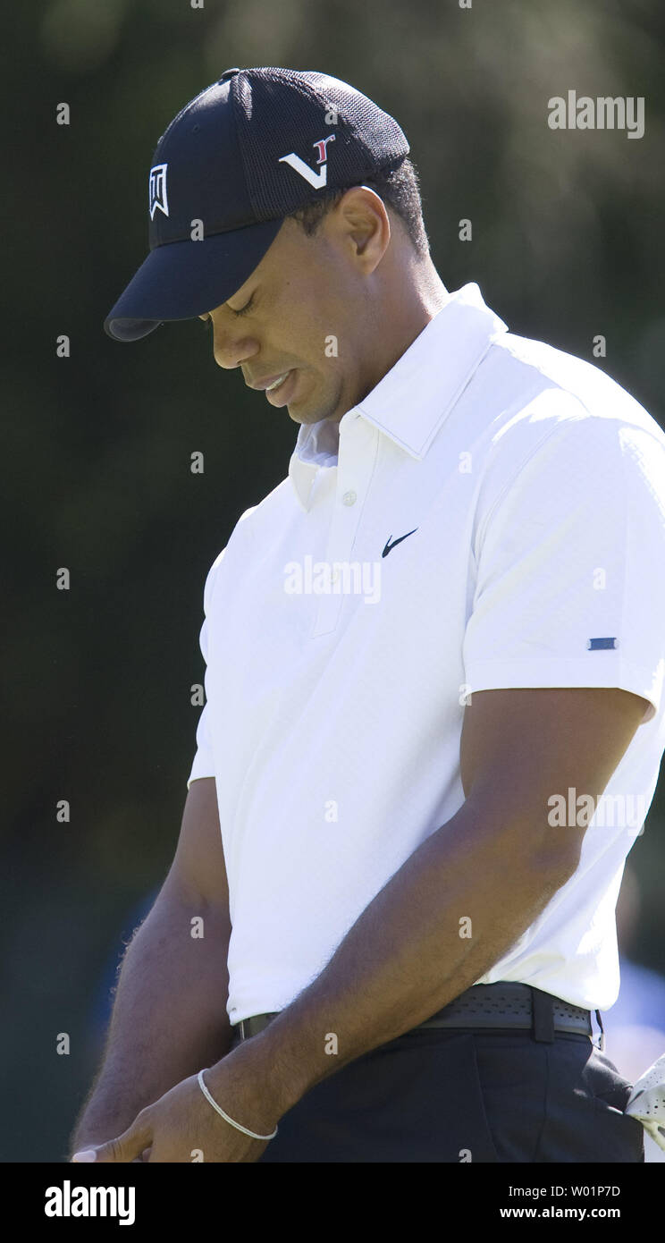 Tiger Woods looks pained as he holds his head down after missing a birdie putt on hole 14 during first round play of the AT&T National at Aronimink Golf Club in Newtown Square, Pennsylvania on July 1, 2010. Woods finished the day with a 3 over par 73.    UPI/John Anderson Stock Photo