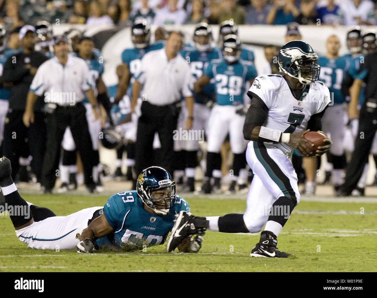 Jacksonville Jaguars Larry Hart trips up Philadelphia Eagles backup quarterback Michael Vick as he tries to run the ball to the goal line during second quarter Philadelphia Eagles-Jacksonville Jaguars game action in Philadelphia at Lincoln Financial Field August 13, 2010.      UPI/John Anderson Stock Photo