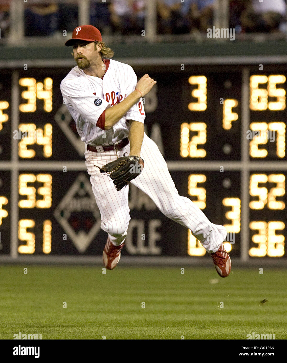Philadelphia Phillies right fielder Jason Werth is off the ground as he tries to catch a hit by Houston Astros Humberto Quintero to first in time, but a throwing error gave Quintero a base hit during fifth inning in Philadelphia August 25, 2010.   UPI/John Anderson Stock Photo