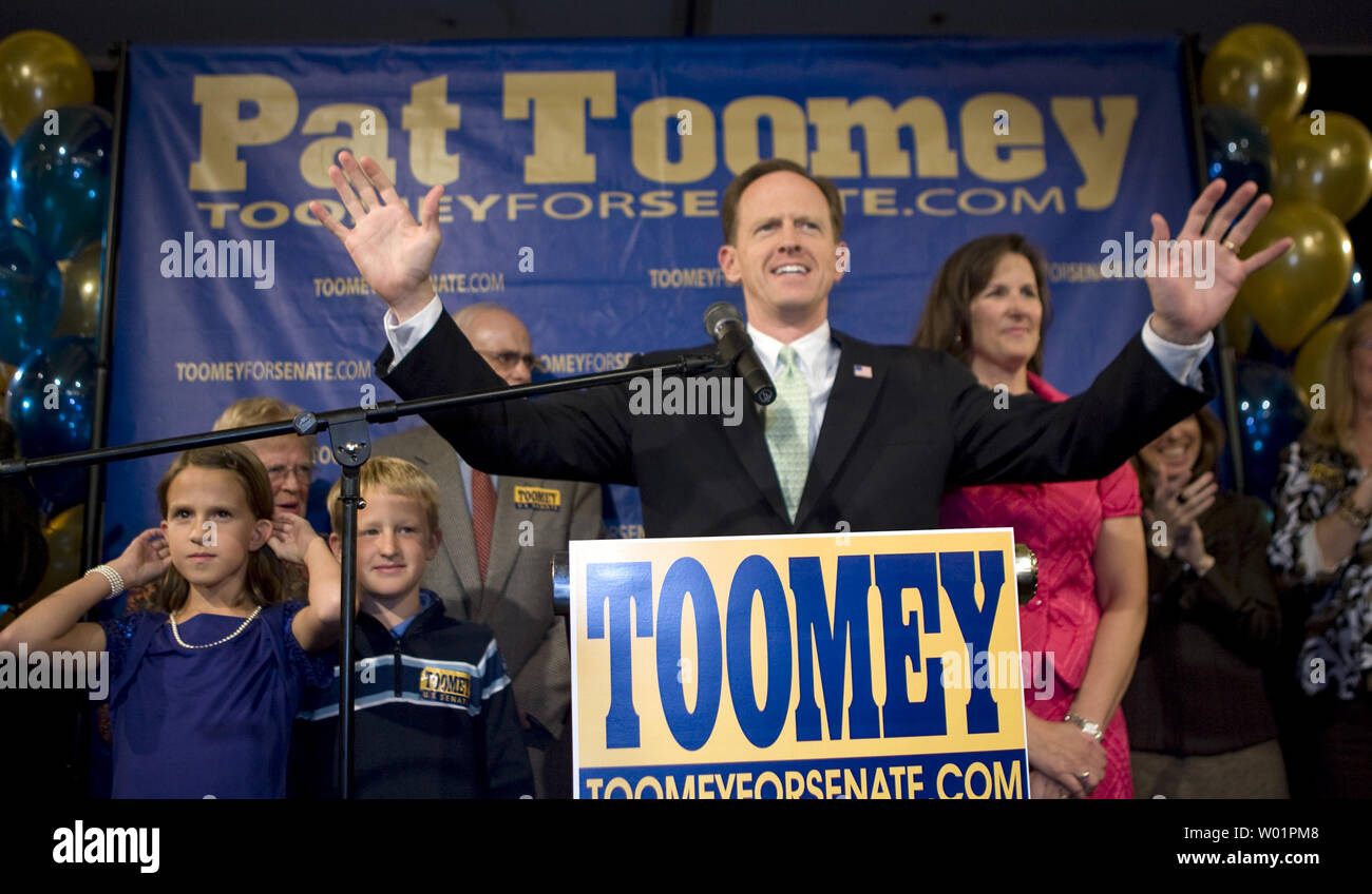 Republican Pat Toomey gestures wide as he greets supporters after winning the election for Pennsylvania U.S. Senator during his victory rally in Breinigsville, Pa. late November 2, 2010.   To his right is his wife, Kris and to his left are two of his children,  Bridget, age 10, and Patrick, age 9 .      UPI/John Anderson Stock Photo