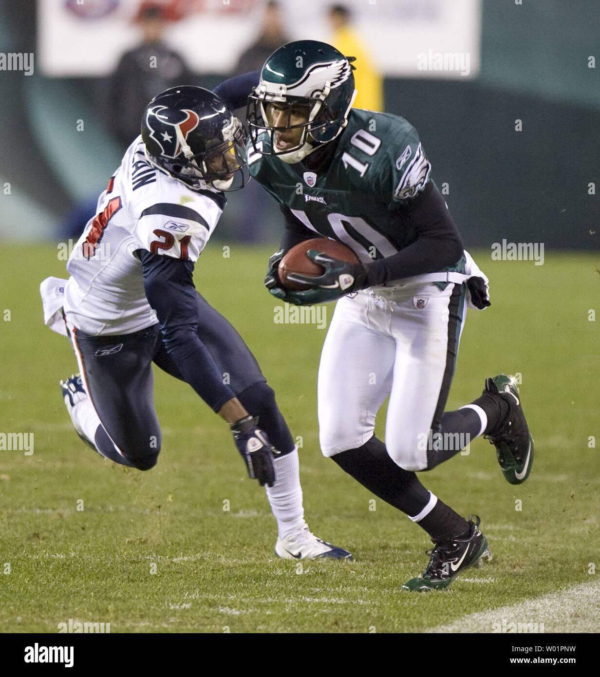 Philadelphia Eagles wide receiver DeSean Jackson evades the grasp of Houston Texans Brice McCain for a 21-yard gain during first quarter Philadelphia Eagles-Houston Texans game action in Philadelphia at Lincoln Financial Field December 2, 2010.    UPI/John Anderson Stock Photo