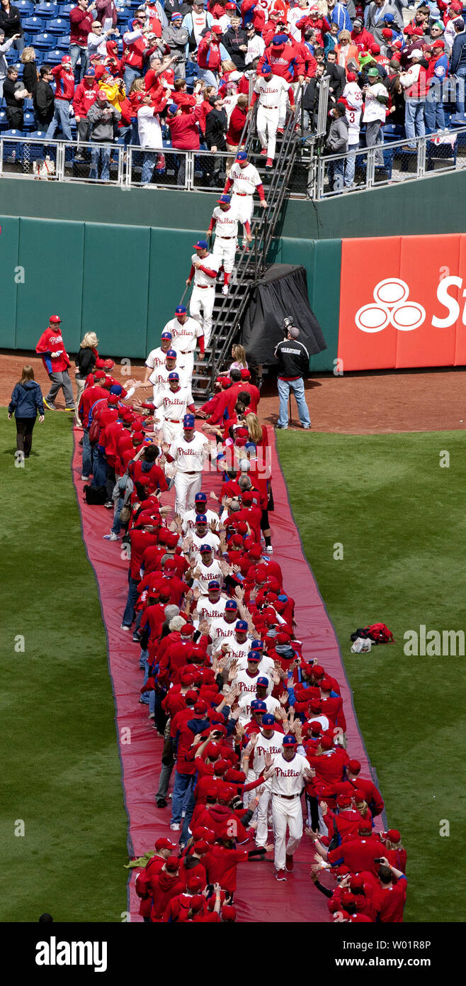 Members of the Philadelphia Phillies walk through a tunnel of fans as they enter the field for the opening day of the Philadelphia Phillies season at Citizens Bank Park in Philadelphia on April 9, 2012. They face the Miami Marlins in their first game at home.    UPI/John Anderson Stock Photo
