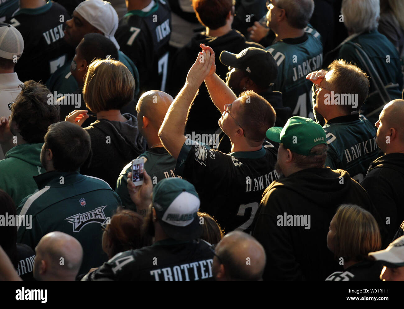 Fans strain to get a glimpse of former Philadelphia Eagles player Brian Dawkins as his number is retired during a ceremony at Lincoln Financial Field in Philadelphia on September 30, 2012.  UPI/Laurence Kesterson Stock Photo