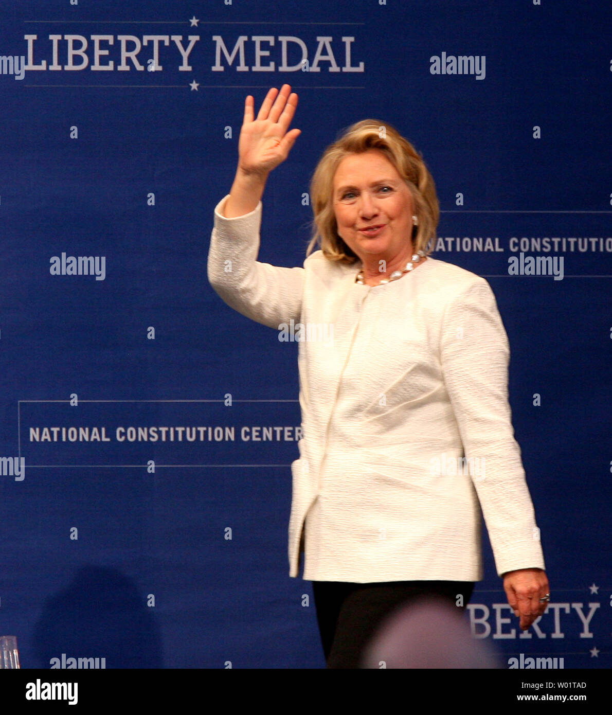 Former Secretary of State and First Lady Hillary Rodham Clinton waves to the crowd as she arrives to receive the  2013 Liberty Medal during ceremonies at the National Constitution Center in downtown Philadelphia September 10, 2013.                  UPI/John Anderson Stock Photo