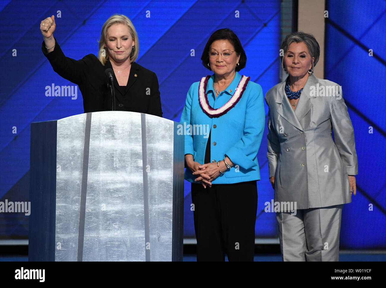 Senator Kirsten Gillibrand of New York, joined by Senators Mazie Hirono of  Hawaii and Barbara Boxer of California, addresses delegates on day four of  the Democratic National Convention at Wells Fargo Center