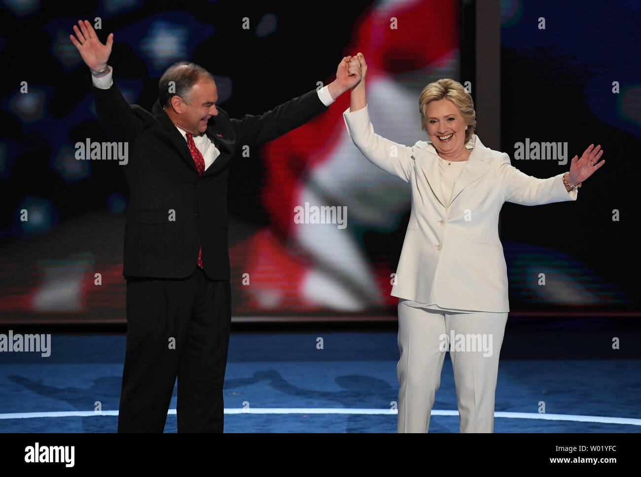 Democratic nominee for president Hillary Clinton is joined on stage by ...