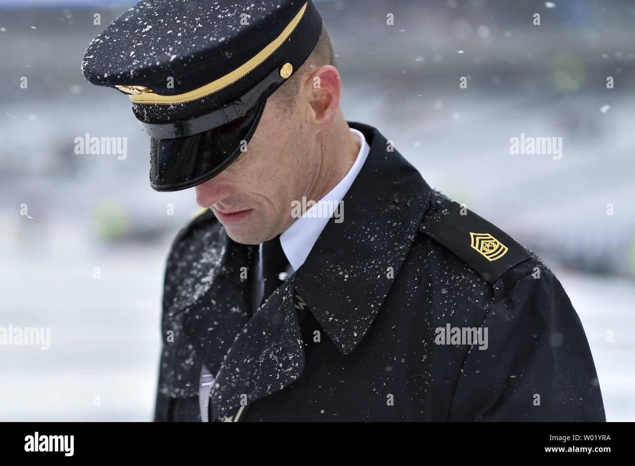 Snow falls on the shoulders of a Naval officer at the 118th meeting between Army and Navy at Lincoln Financial Field in Philadelphia, Pennsylvania on December 9, 2017. The Army-Navy Game is an American college rivalry game in college football between the Army Black Knights of the United States Military Academy (USMA) at West Point, New York, and the Navy Midshipmen of the United States Naval Academy (USNA) at Annapolis, Maryland.      Photo by Derik Hamilton/UPI Stock Photo