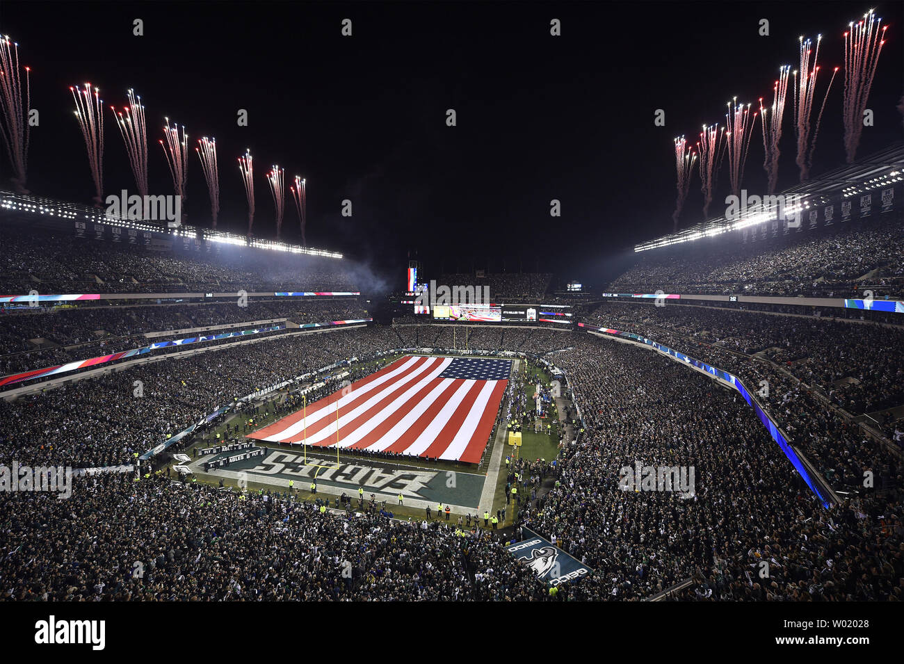 Fireworks line the stadium during the national anthem before the