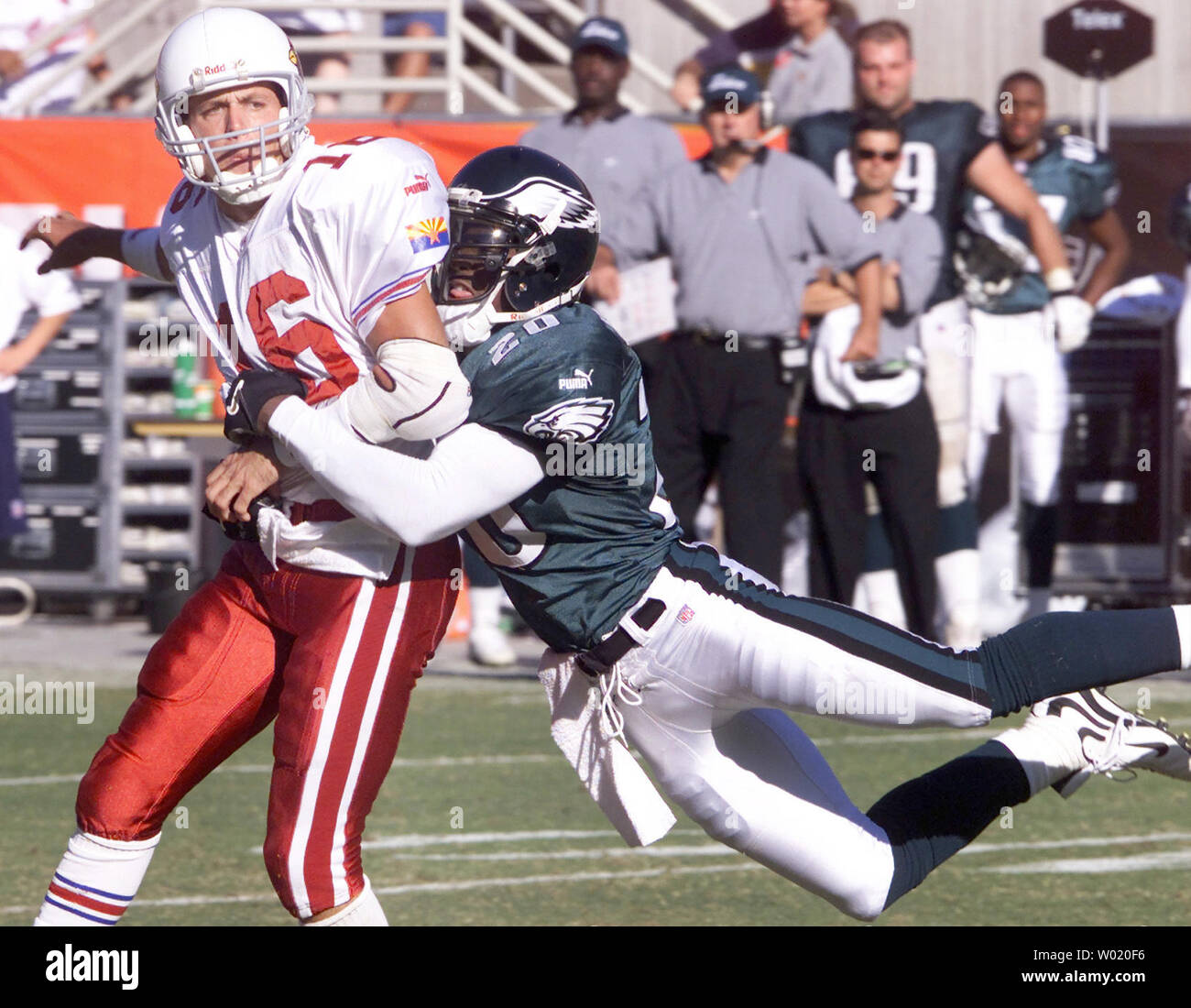 PHO2000101506 - 15 OCTOBER 2000 - TEMPE, ARIZONA, USA: Jake Plummer, Arizona Cardinals' quarterback, is wrapped up Brian Dawkins, Philadelphia Eagles safety in the fouth quarter of the Cardinals-Eagles game at Sun Devil Stadium in Tempe, AZ, Oct. 15. Plummer, who hadn't thrown an interception in the two previous games, threw two against the Eagles Sunday. The Eagles beat the Cardinals 33-14. The loss dropped the Cardinals to 2 - 4. The Eagles improved to 4 - 3.     cc/jk/Jack Kurtz      UPI Stock Photo