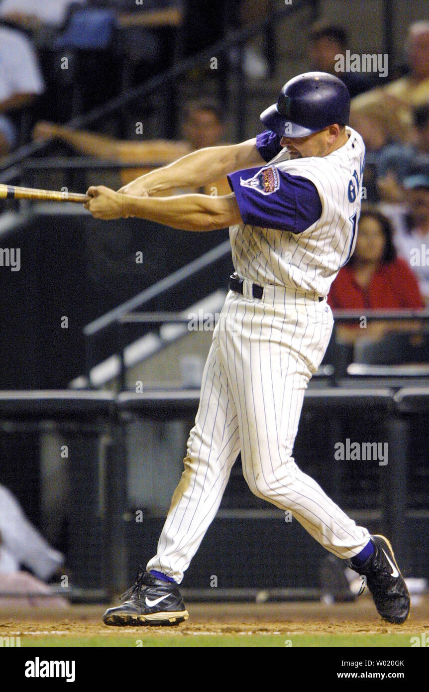 PHO2001050907 - 09 MAY 2001 - PHOENIX, ARIZONA, USA: Mark Grace, Arizona  Diamondbacks' first baseman, launches a one run home run into the stands  during the 6th inning of the Diamondbacks' home
