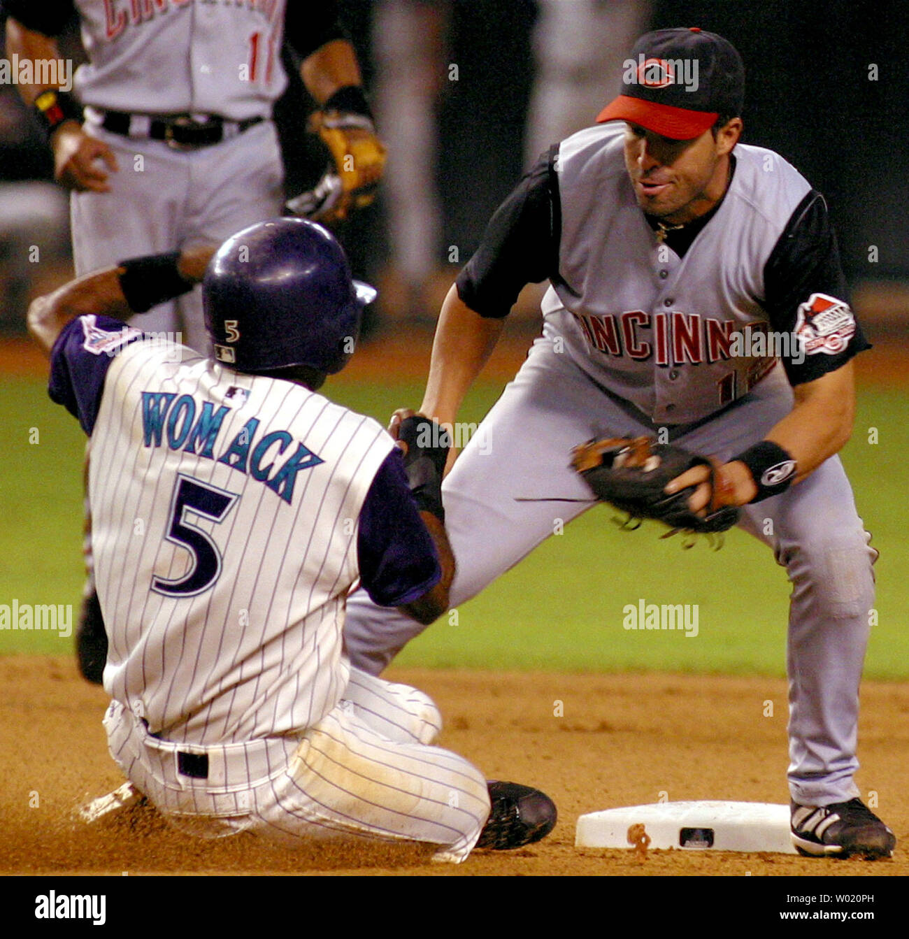 PHO2002082004 - PHOENIX, August 20  (UPI)  -- Cincinnati Reds second baseman Todd Walker waits for Arizona Diamondbacks Tony Womack to slide trying unsuccessfully to steal second. The D'backs defeated the Reds 5-3 in Phoenix, Arizona  on August 20, 2002.     mk/wp/Will Powers     UPI Stock Photo