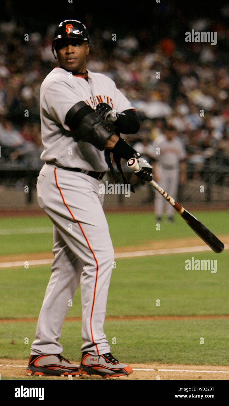 San Francisco Giants Barry Bonds removes his protective armor after he is  intentionally walked in the eighth inning by the Arizona Diamondbacks in  Phoenix, AZ April 17, 2006. Bonds was then lifted