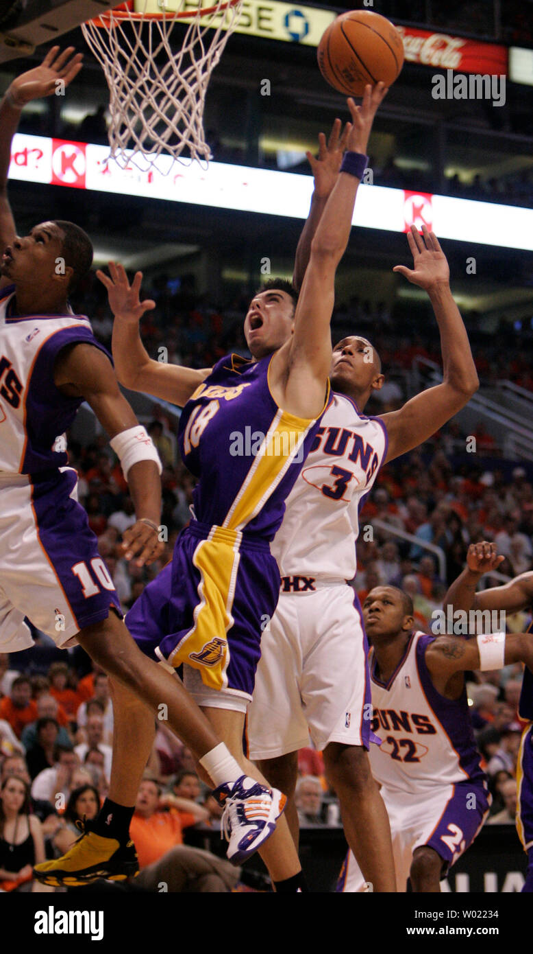 Los Angeles Lakers Sasha Vujacic reaches for a reboundagainst  Phoenix Suns Boris Diaw in thefourth quarter of the first game of the NBA play offs in Phoenix, AZ April 23, 2006. The Suns defeated the Lakers 107-102.     (UPI Photo/Will Powers) Stock Photo
