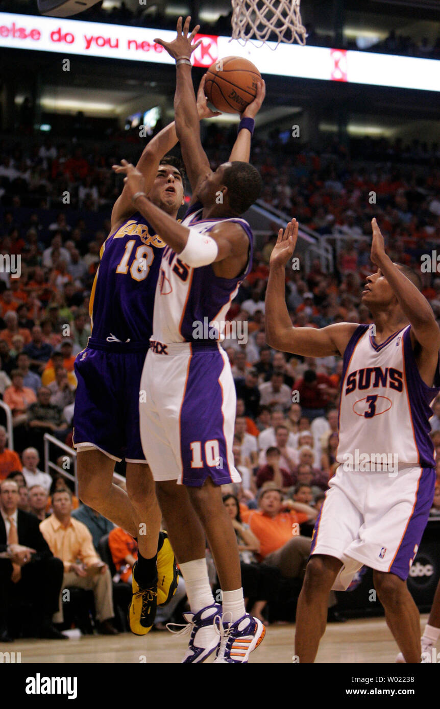 Los Angeles Lakers Sasha Vujacic drives the baseline and is fouled by Phoenix Suns Leandro Barbosa, in the third quarter of the first game of the NBA play offs in Phoenix, AZ April 23, 2006. The Suns defeated the Lakers 107-102.     (UPI Photo/Will Powers) Stock Photo