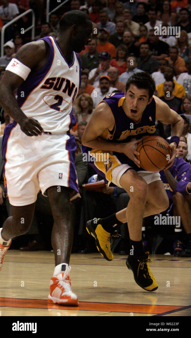 Los Angeles Lakers Sasha Vujacic tries to drive the baseline against  Phoenix Suns Tim Thomas in the first quarter of the second game of the NBA play offs in Phoenix, AZ April 26, 2006.       (UPI Photo/Will Powers) Stock Photo