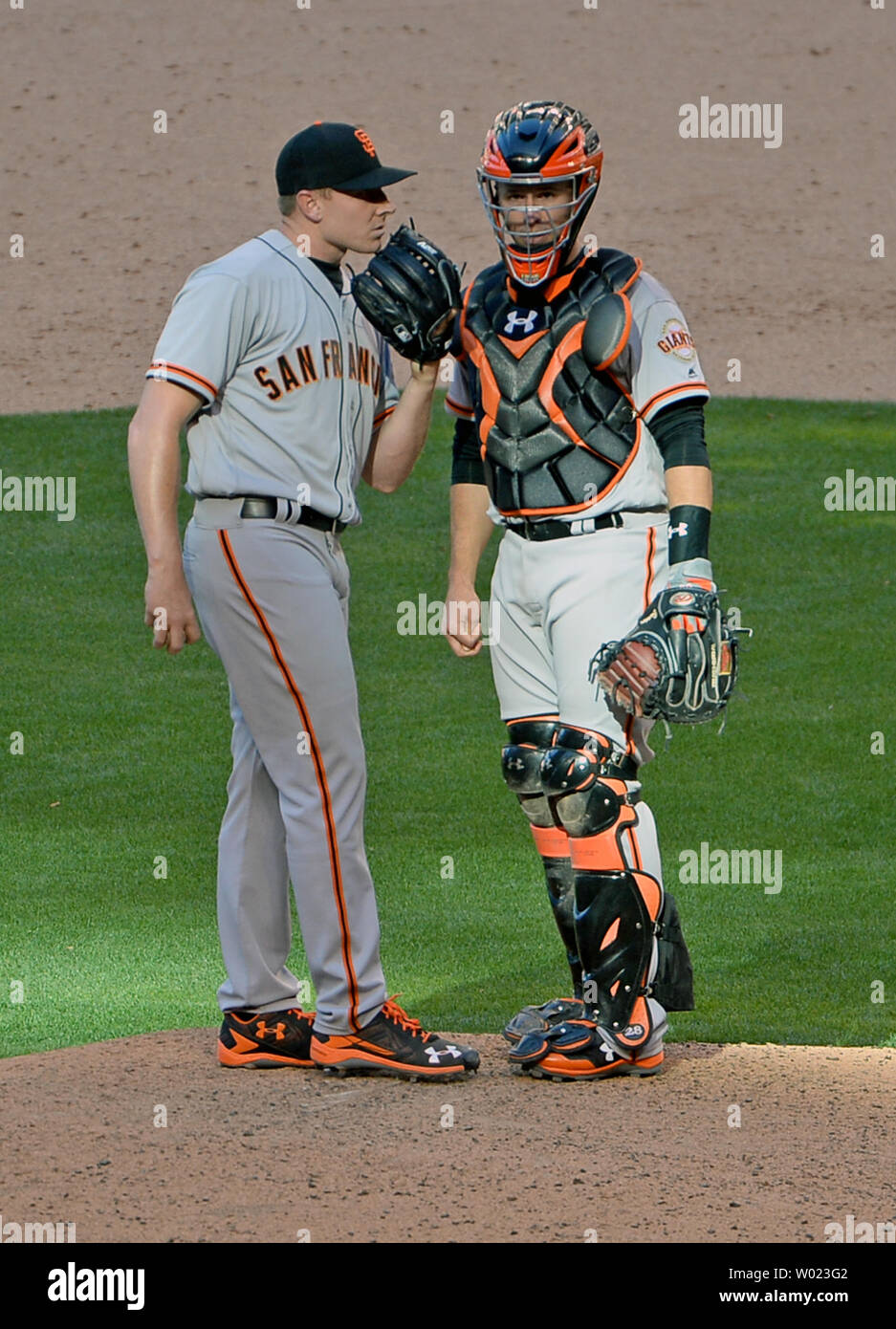 San Francisco Giants pitcher Mark Melancon (L) talks with catcher Buster Posey in the ninth inning during the Opening Day Game against the Arizona Diamondbacks at Chase Field in Phoenix, Arizona, April 2,2017. The Diamondbacks defeated the Giants 6-5. Photo by Art Foxall/UPI .... Stock Photo