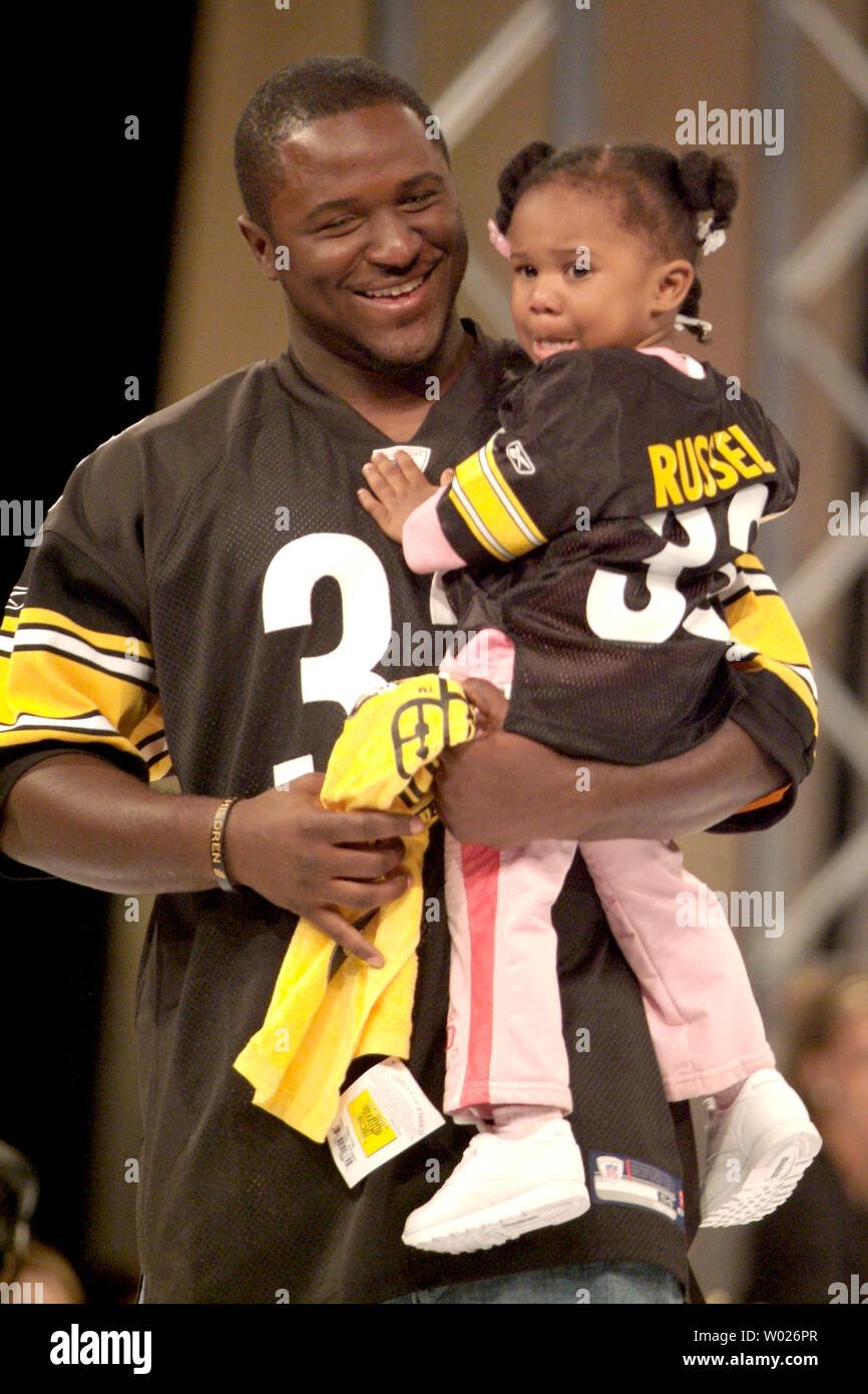 Pittsburgh Steelers Gary Russell with daughter Kimora walks the runway during the Steeler Style 2007 Fashion Show benefiting  the Thomas E Starzl Transplant Institute and the Cancer Caring Center on October 5, 2007 in Pittsburgh. (UPI Photo/Archie Carpenter) Stock Photo