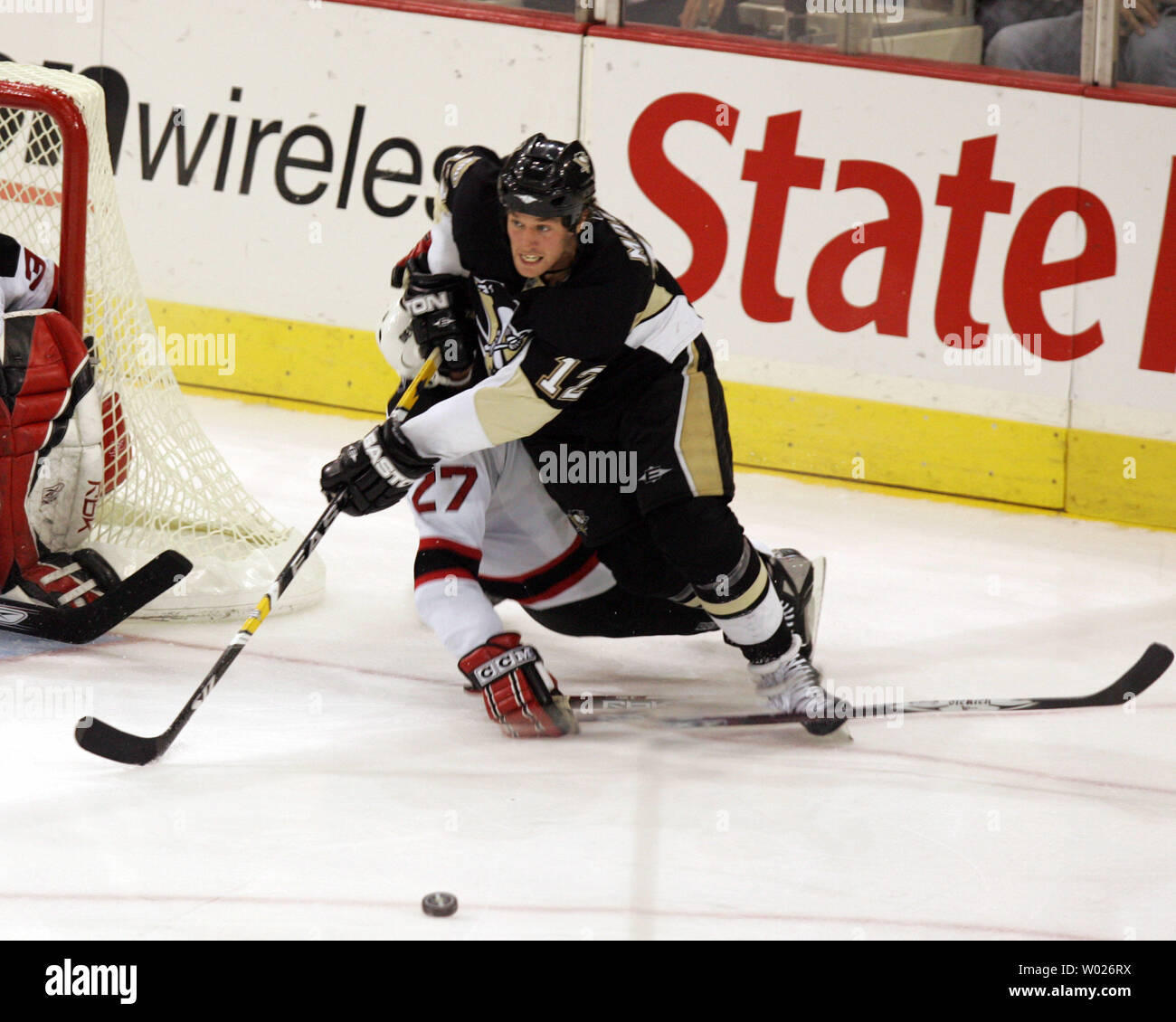 Pittsburgh Penguins Jordan Staal (11) gets tanged up with New Jersey Devils  Mike Mottau during the third period at the Mellon Arena in Pittsburgh on  April 1, 2009. .(UPI Photo/Stephen Gross Stock