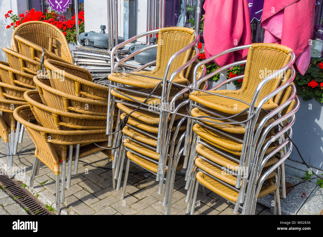 Secured chairs outside café - Brussels. Stock Photo
