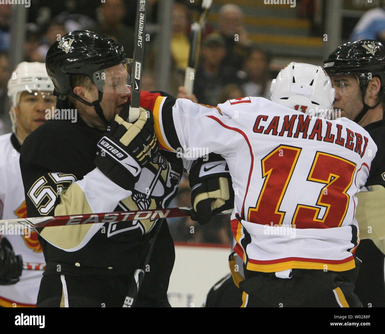 A fight breaks out between the Calgary Flames Michael Cammalleri (13) and the Pittsburgh Penguins Sergei Gonchar (55) in the second period at the Mellon Arena in Pittsburgh on March 25, 2009.    (UPI Photo/Stephen Gross) Stock Photo