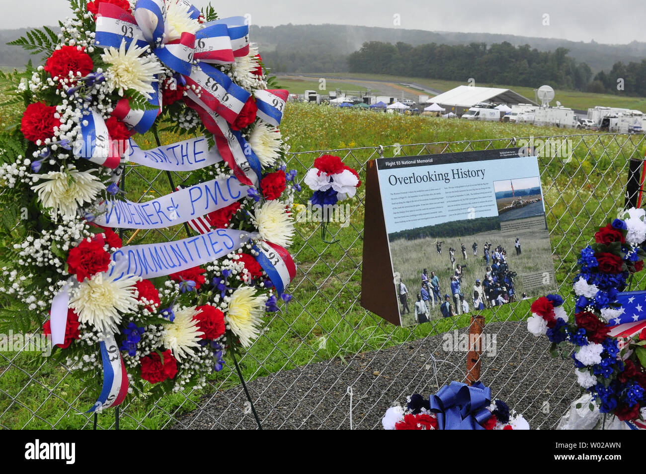 Media satellites trucks forms a backdrop for flags, messages and flowers left at the Temporary Memorial on September 9, 2011, the eve of the dedication of the permanent National Memorial overlooking the crash site of Flight 93 where 40 people lost then lives 10 years ago in the terrorist attacks of September 11, 2001.   UPI/Archie Carpenter Stock Photo