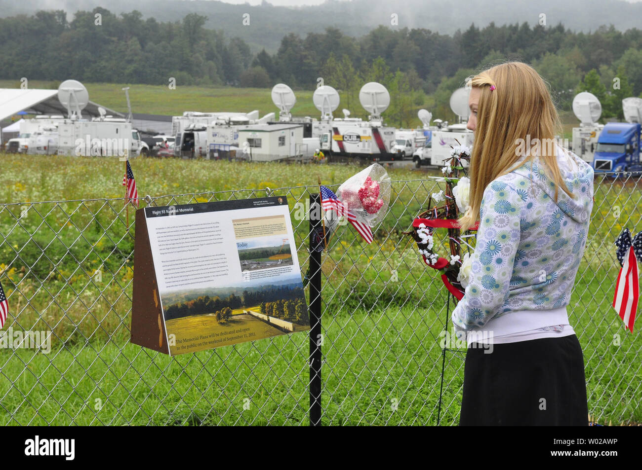 Media satellites trucks forms a backdrop for flags, messages and flowers left at the Temporary Memorial on September 9, 2011, the eve of the dedication of the permanent National Memorial overlooking the site of the crash site of Flight 93 where 40 people lost their lives 10 years ago in the terrorist attacks of September 11, 2001.   UPI/Archie Carpenter Stock Photo