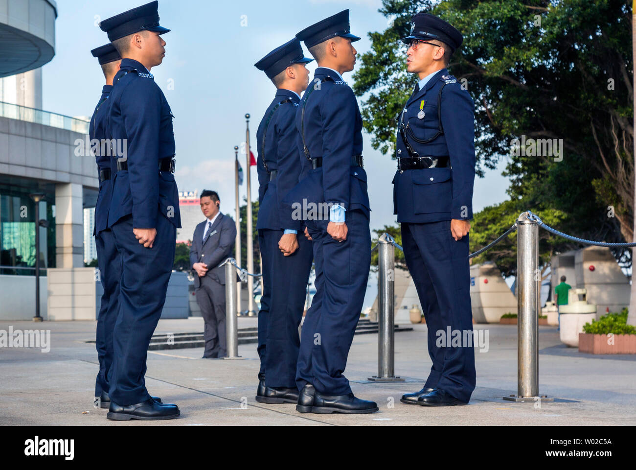 Hong Kong Police at flag raising ceremony, Exhibition and Conference Centre, Hong Kong, SAR, China Stock Photo