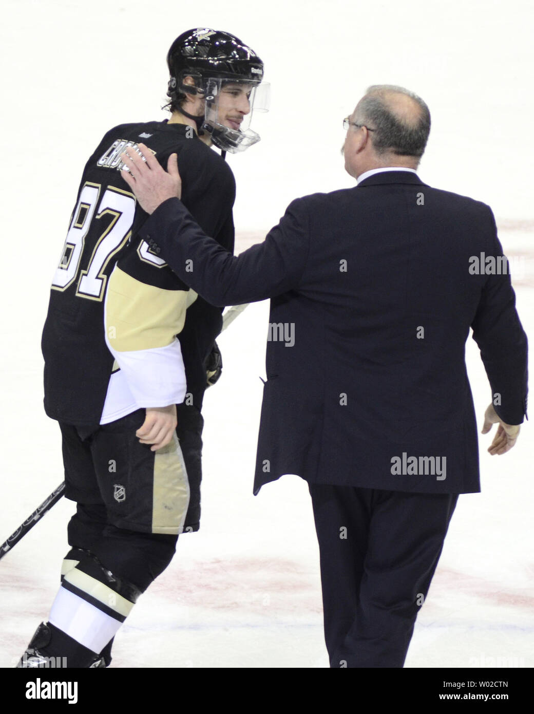 Ottawa Senators Head Coach Paul MacLean congratulates Pittsburgh Penguins center Sidney Crosby (87) following the end of the 6-2 win in game five the of the Eastern Conference Semifinals Playoffs at the Consol Energy Center in Pittsburgh on May 24, 2013.   UPI/Archie Carpenter Stock Photo