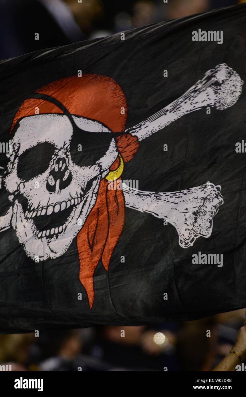 A Pittsburgh Pirates fan waves a Jolly Roger during the opening day baseball  game between the Pittsburgh Pirates and the St. Louis Cardinals at PNC Park  in Pittsburgh, Sunday, April 3, 2016.