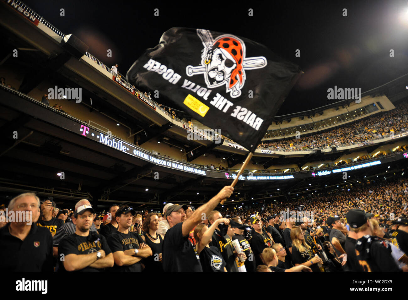 Pittsburgh Pirates fans raise the Jolly Roger as they cheer in the 9th  inning of game 3 of the NLDS against the St. Louis Cardinals at PNC Park in  Pittsburgh, Pennsylvania on