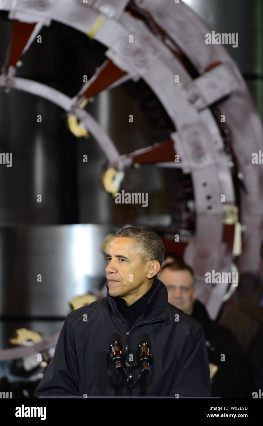 President Barack Obama pauses as he addresses workers and guests at the U. S. Steel Irvin Plant in West Mifflin, Pennsylvania before signing a presidential memorandum for MyIRA, a new retirement plan, on January 29, 2014.   UPI/Archie Carpenter Stock Photo