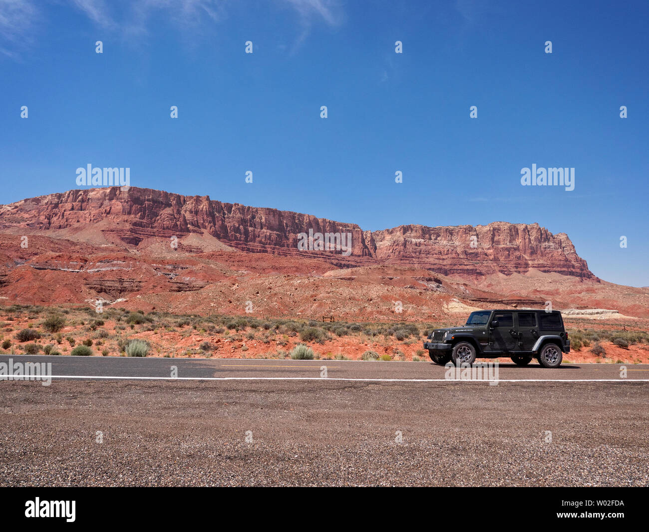Jeep Wrangler driving on HWY 89A Arizona by the Vermillion Cliffs. Stock Photo
