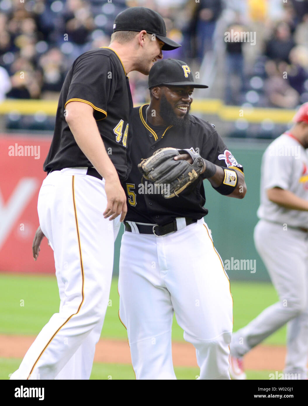 Pittsburgh Pirates relief pitcher Jared Hughes (48) celebrates the 8-2 win over the St. Louis Cardinals with Pittsburgh Pirates third baseman Josh Harrison (5)  at PNC Park in Pittsburgh on September 30, 2015.  Photo by Archie Carpenter/UPI Stock Photo
