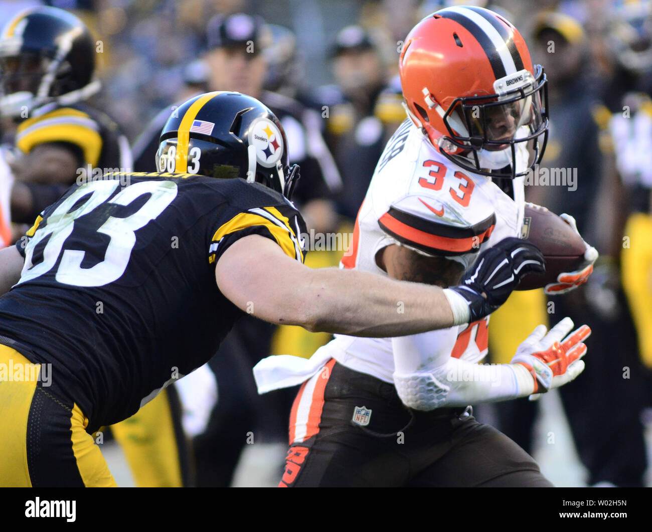 Cleveland Browns free safety Jordan Poyer (33) returns his interception 12  yards in the fourth quarter