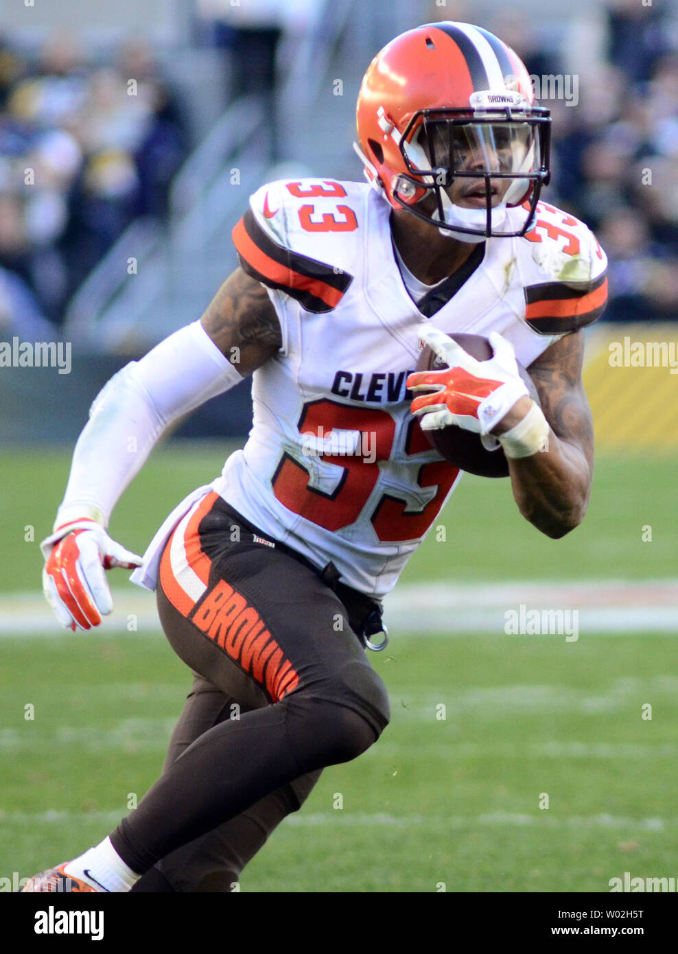 Cleveland Browns free safety Jordan Poyer (33) returns his interception 12  yards in the fourth quarter