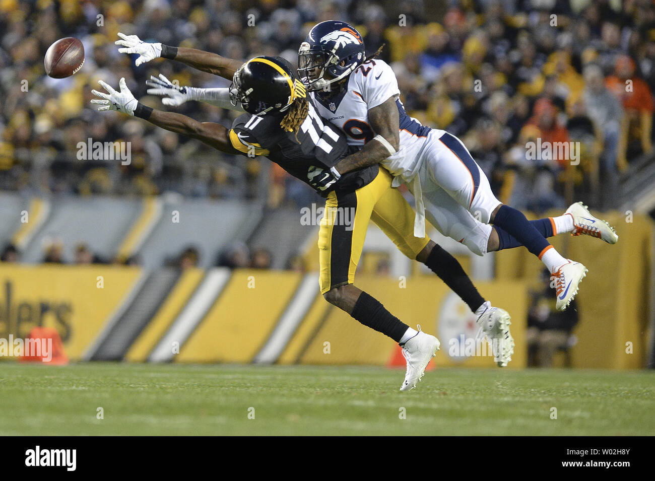Denver Broncos free safety Bradley Roby (29) deflects a pass intended for Pittsburgh Steelers wide receiver Markus Wheaton (11). Denver Broncos defensive back Josh Bush caught the deflected ball and ran for a 13 yard gain during the game at Heinz Field in Pittsburgh on December 20, 2015.  Photo by Shelley Lipton/UPI Stock Photo