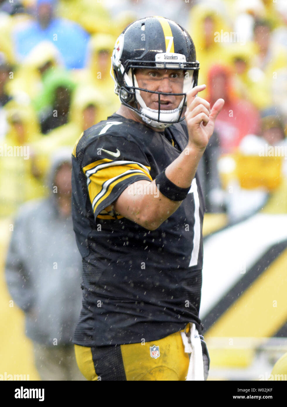 Cincinnati Bengals Michael Johnson holds on the jersey and sacks Pittsburgh  Steelers quarterback Ben Roethlisberger for a lost of eight yards in the  second quarter at Heinz Field in Pittsburgh, Pennsylvania on