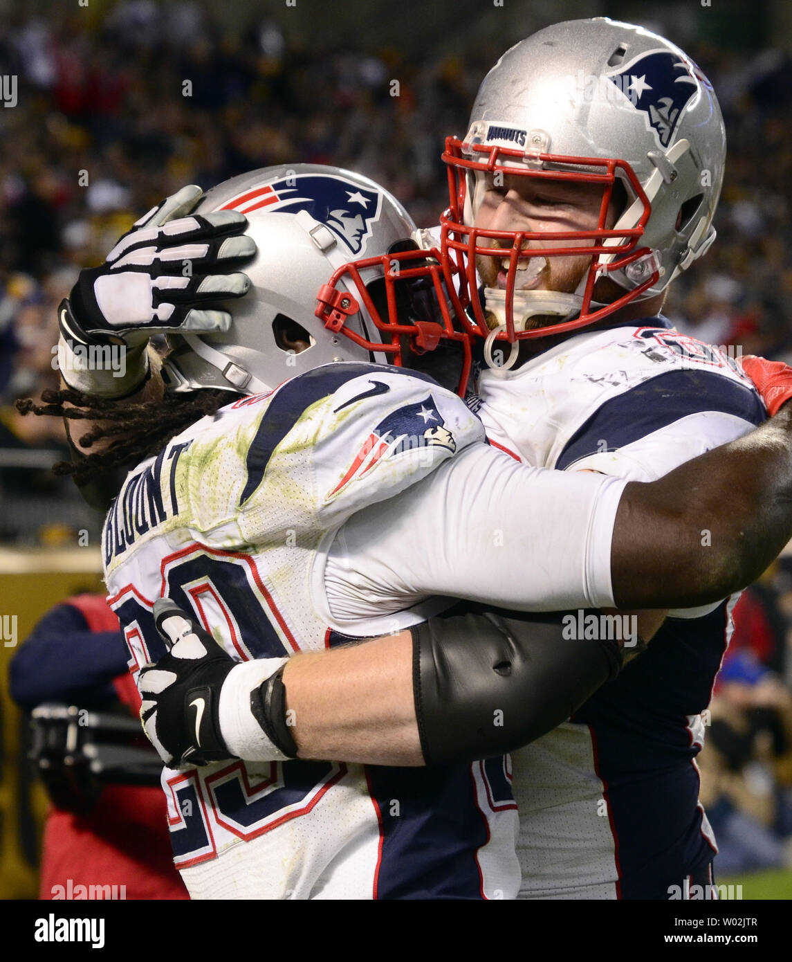 New England Patriots guard Justin Herron (75) stands on the sideline prior  to the second half an NFL football game against the Jacksonville Jaguars,  Sunday, Jan. 2, 2022, in Foxborough, Mass. (AP