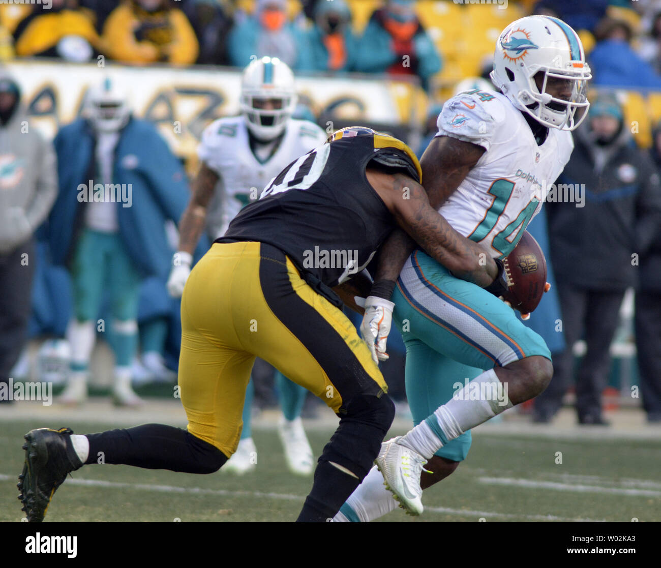 Pittsburgh Steelers inside linebacker Ryan Shazier (50) stops Miami Dolphins  wide receiver Jarvis Landry (14) late in the fourth quarter of the Pittsburgh  Steelers 30-12 win at the AFC Wild Card Playoff