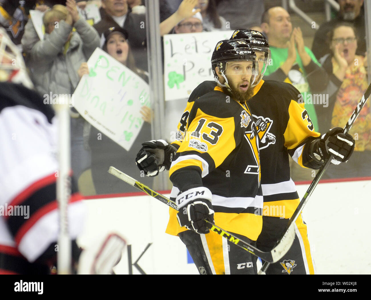 https://c8.alamy.com/comp/W02KJ8/pittsburgh-penguins-center-nick-bonino-13-celebrates-his-goal-with-pittsburgh-penguins-right-wing-tom-kuhnhackl-34-in-the-second-period-against-the-new-jersey-devils-at-the-ppg-paints-arena-in-pittsburgh-on-march-17-2017-upiarchie-carpenter-W02KJ8.jpg