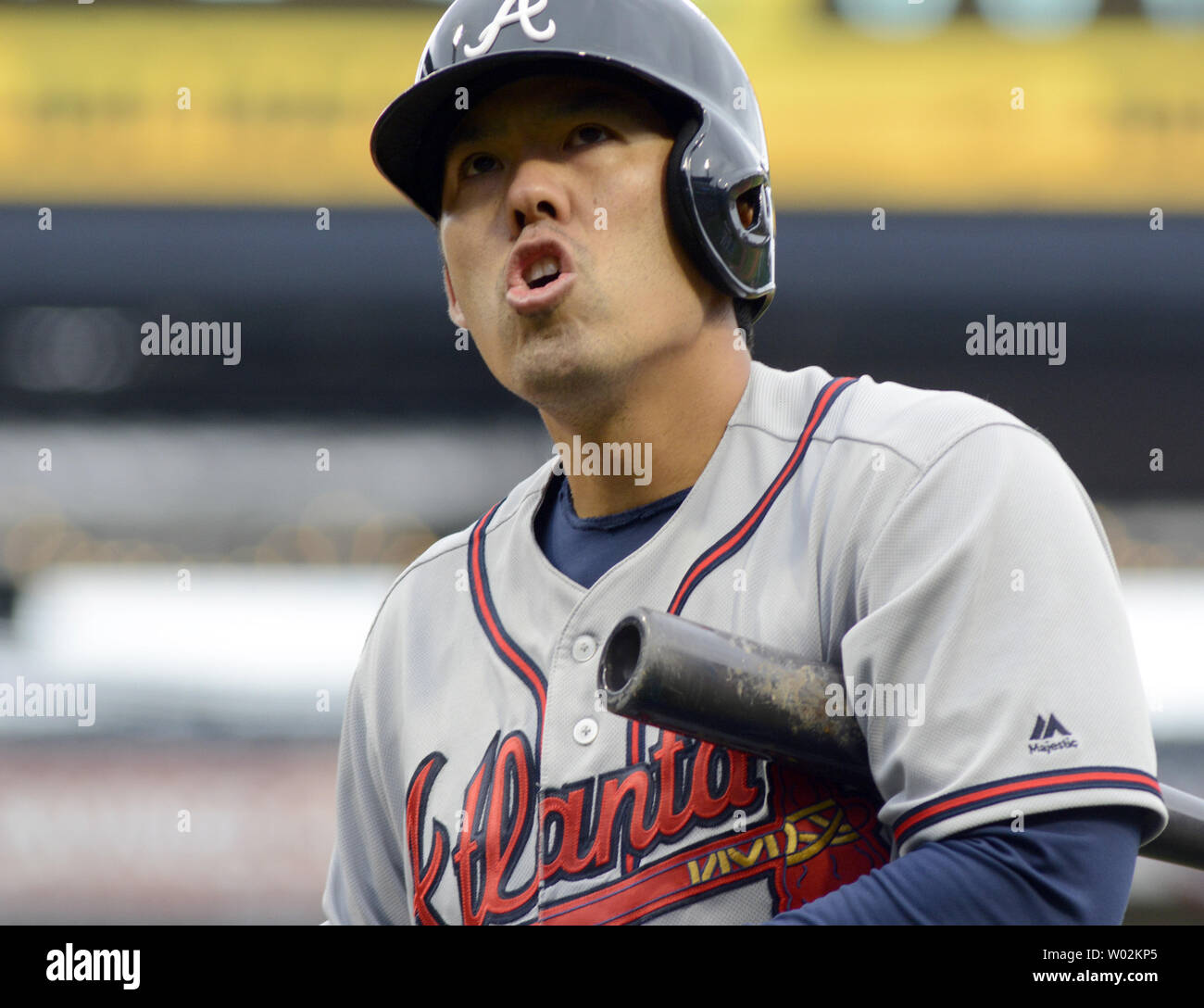 Atlanta Braves catcher Kurt Suzuki returns to the dugout after warms ups  prior to a baseball game against the Washington Nationals in, Saturday,  July 8, 2017, in Washington. (AP Photo/Mark Tenally Stock